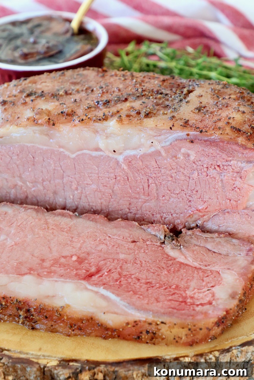 Smoked New York Strip Roast Recipe and Smoking Tips 2 smoked new york strip roast sliced on wood board