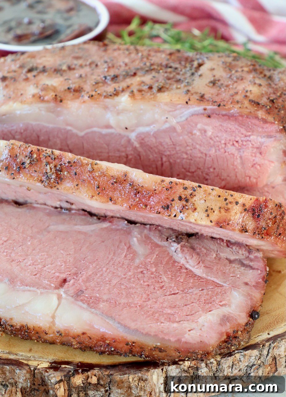 Smoked New York Strip Roast Recipe and Smoking Tips 13 sliced, smoked new york strip roast on wood board