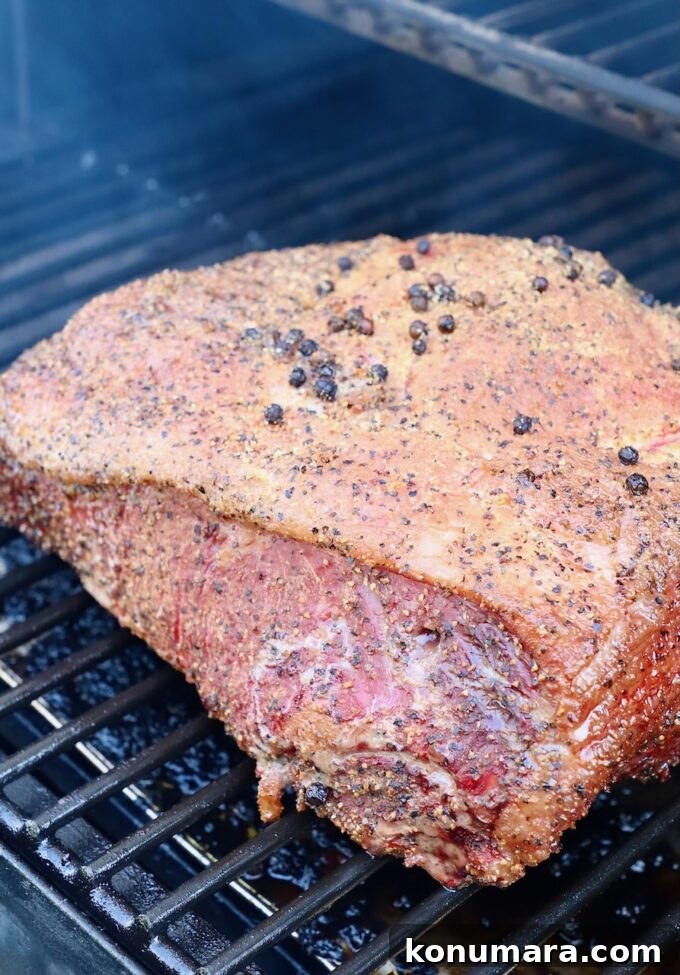Smoked New York Strip Roast Recipe and Smoking Tips 7 seasoned strip roast on smoker