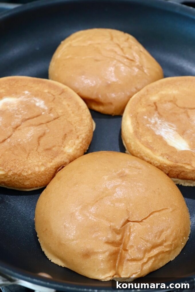 Classic Roast Beef Sandwich Recipe with Horseradish 4 brioche buns toasting in skillet