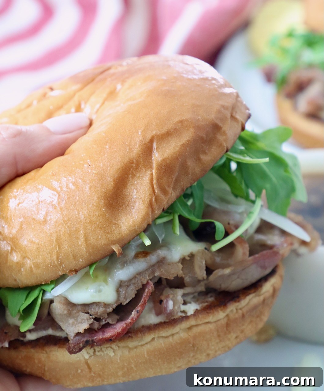 Classic Roast Beef Sandwich Recipe with Horseradish 8 hand holding roast beef sandwich