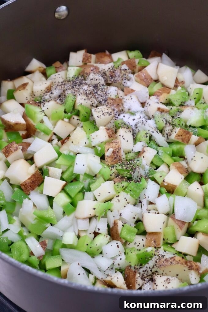 Skillet Philly Cheesesteak Hash with Peppers and Onions 5 seasoned diced potatoes and vegetables in dutch oven