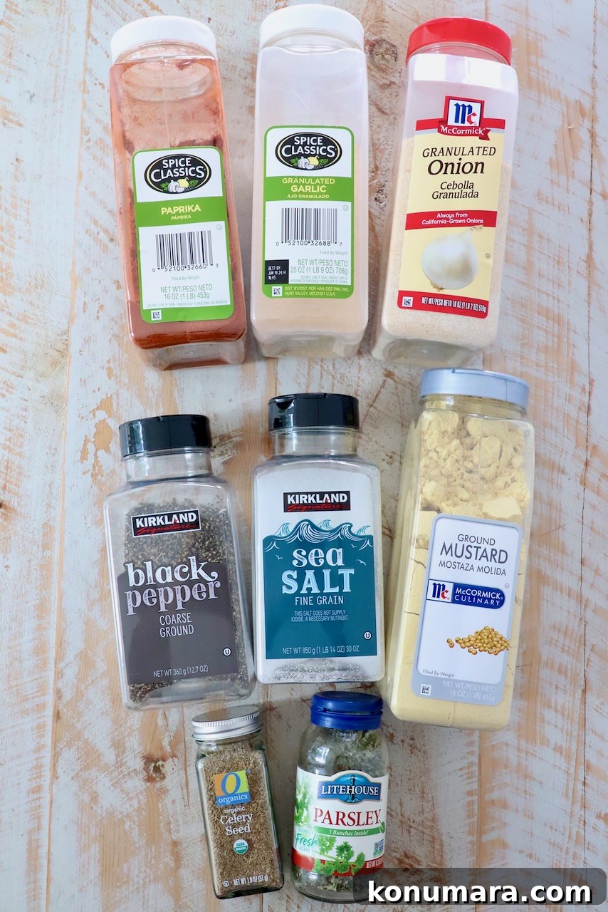 herbs and spices in plastic containers on white wood board