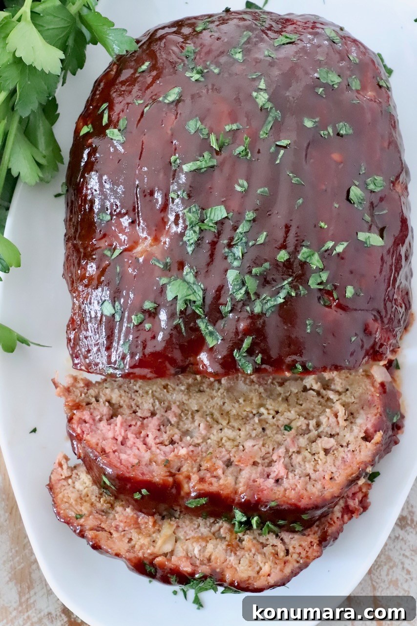How to Smoke Meatloaf for Tender, Flavorful Results 2 glazed smoked meatloaf sliced on plate