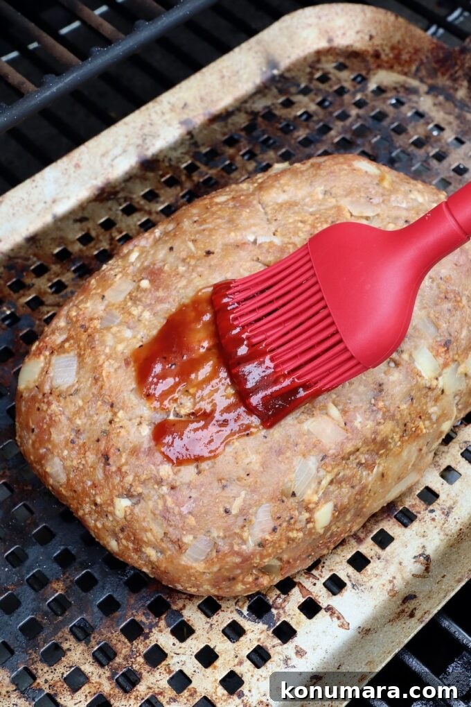 How to Smoke Meatloaf for Tender, Flavorful Results 6 meatloaf in smoker, brushed with bbq sauce