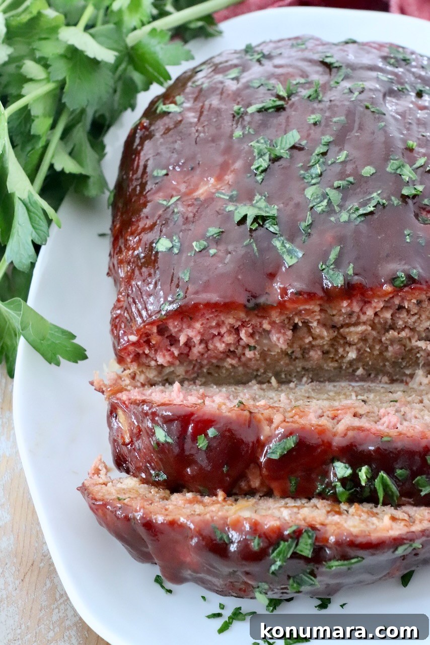 How to Smoke Meatloaf for Tender, Flavorful Results 8 glazed smoked meatloaf on plate, sliced