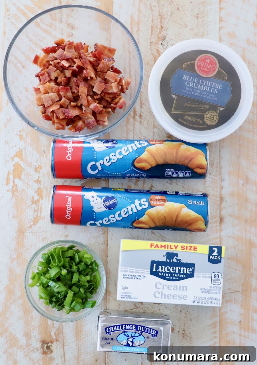 ingredients for cheesy bacon crescent rolls on white wood board