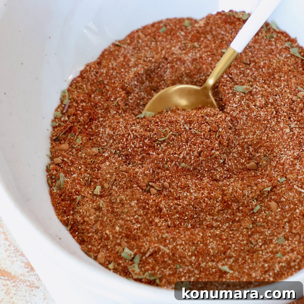 enchilada seasoning in bowl with spoon
