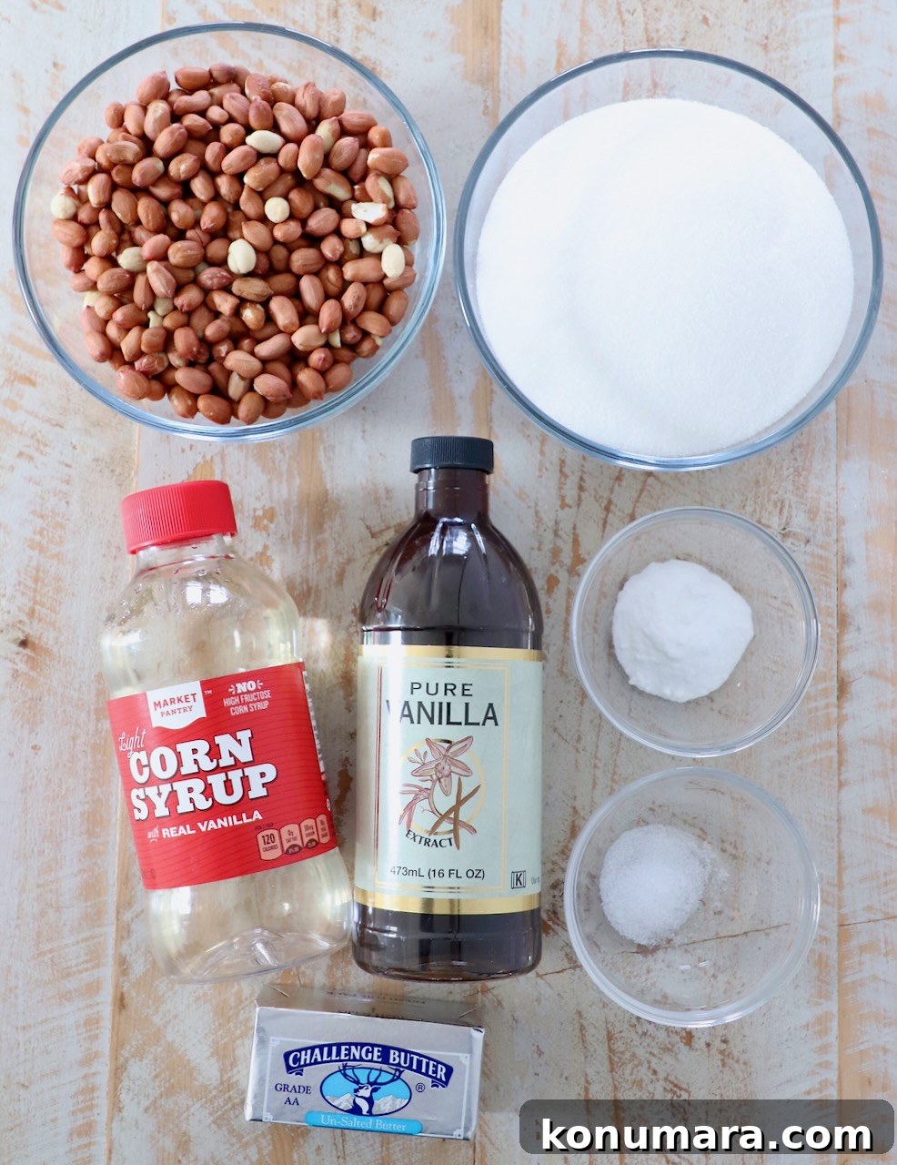 ingredients for peanut brittle on white wood board