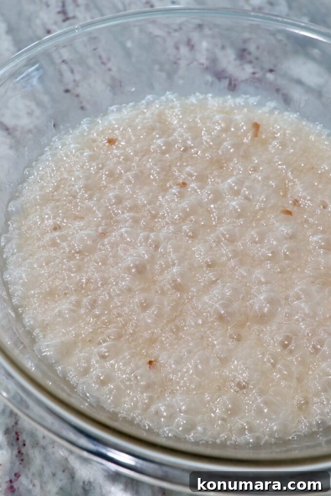 microwaved sugar, corn syrup, butter and peanuts in a large glass bowl