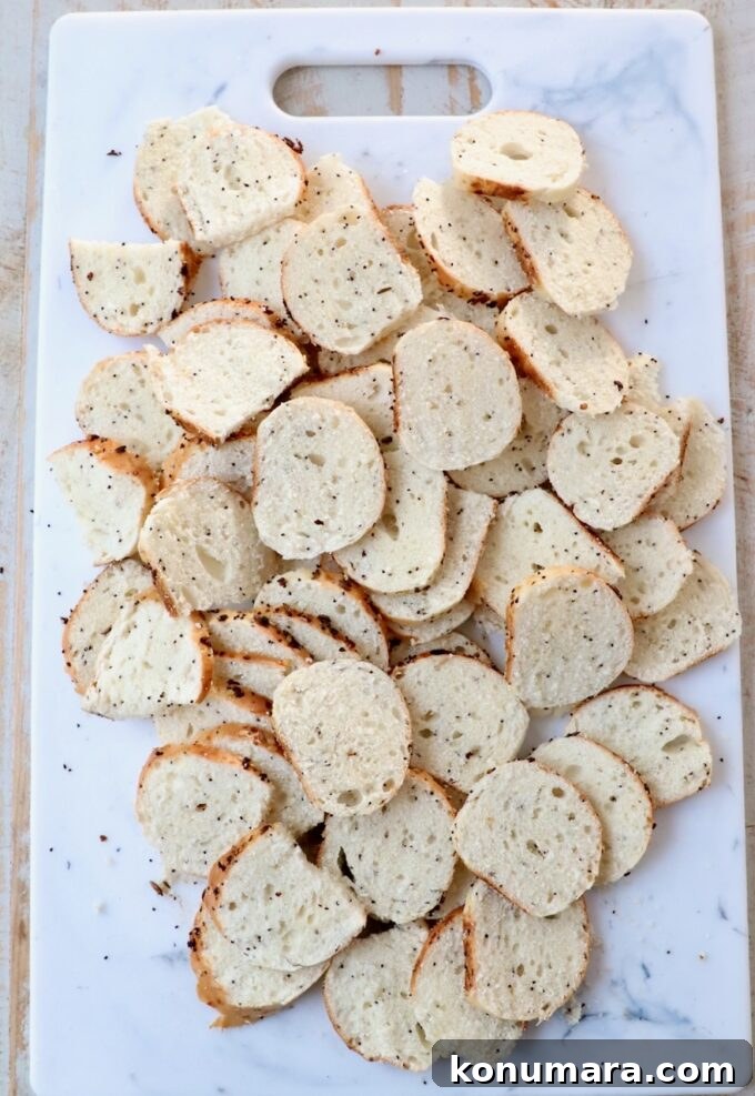 Crispy Homemade Bagel Chips: Recipe and Flavor Ideas 4 sliced bagels on cutting board