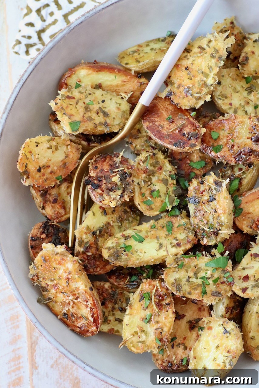 roasted baby potatoes in bowl with fork