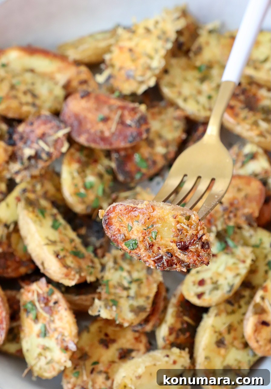 roasted mini potatoes in bowl with fork