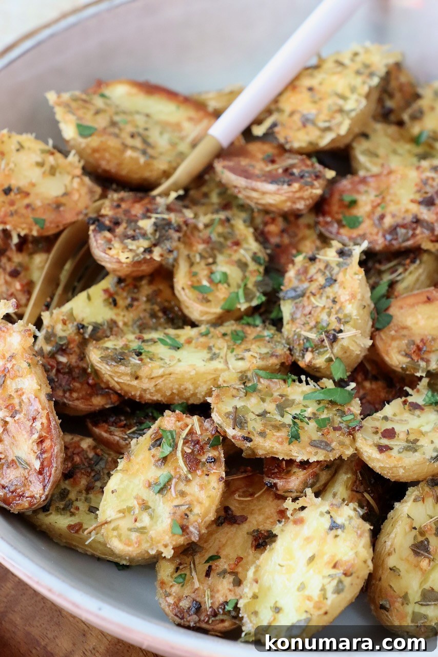 roasted baby potatoes in bowl with fork