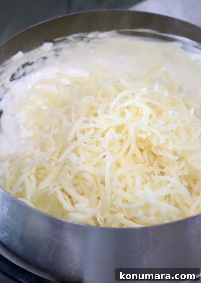 shredded swiss cheese in fondue pot