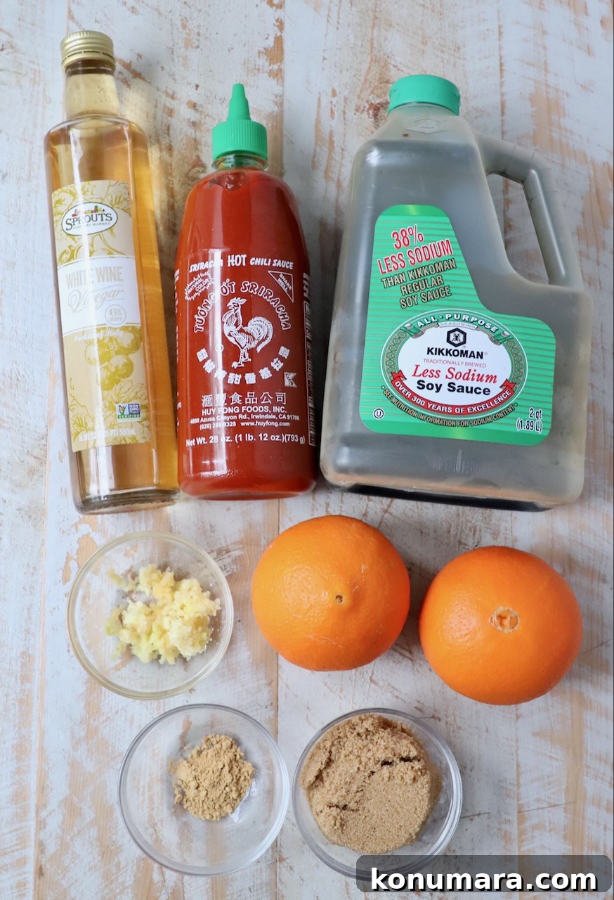 Tangy Orange Sauce Recipe for Chicken, Duck and Desserts 3 ingredients for Chinese orange sauce on white wood board