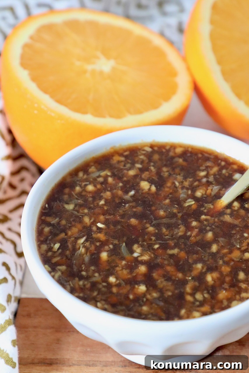 Tangy Orange Sauce Recipe for Chicken, Duck and Desserts 5 orange sauce in bowl with spoon