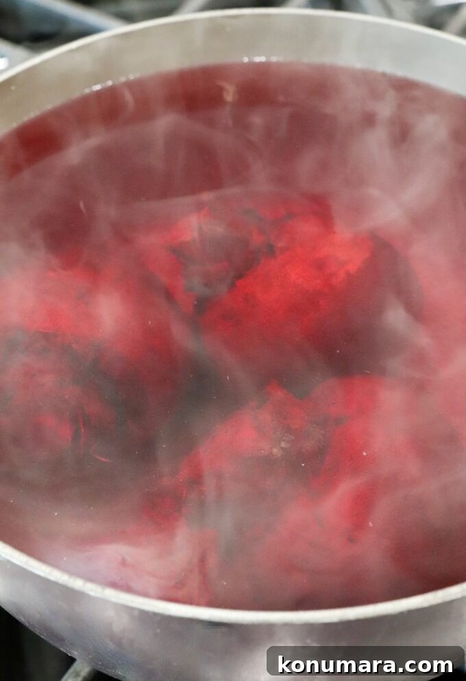 How to Cook Beets: Roast, Boil, and Sauté 15 beets boiling in water in a pot on the stove