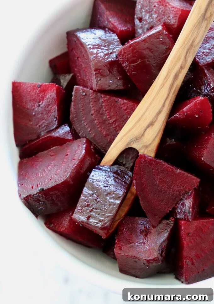How to Cook Beets: Roast, Boil, and Sauté 16 diced cooked beets in a bowl with wooden fork