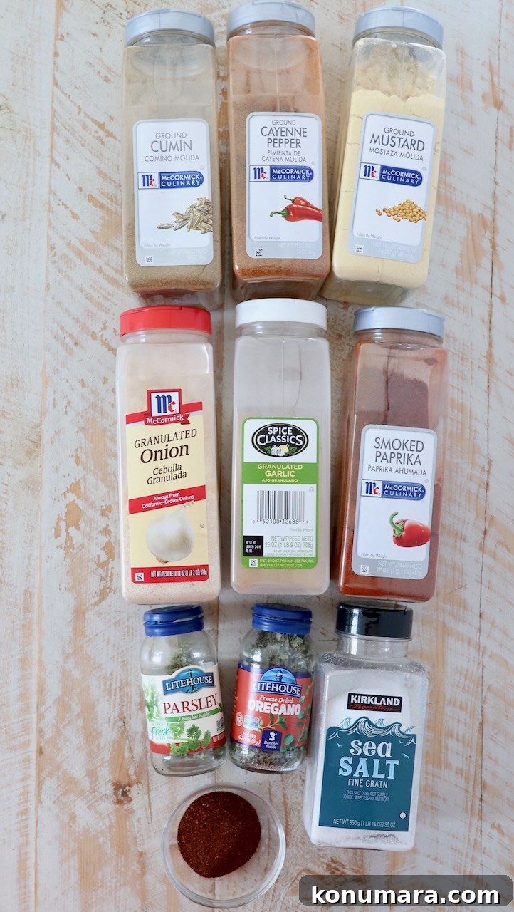ingredients for southwest seasoning on white wood board