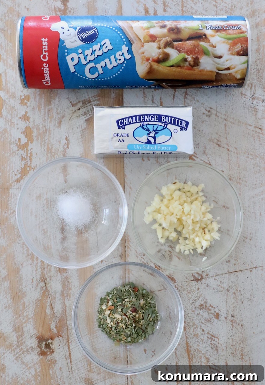 ingredients for garlic knots on white wood board