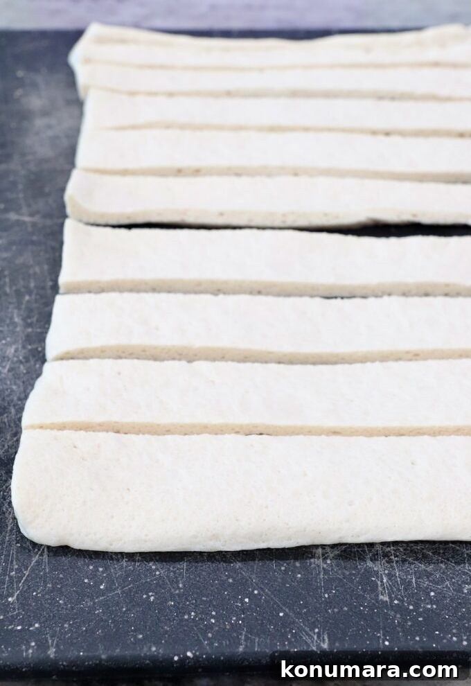 sliced pizza dough on a cutting board