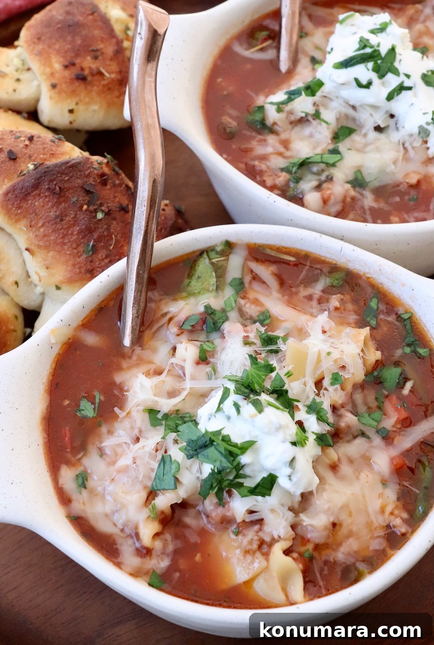 One-Pot Cheesy Lasagna Soup with Italian Sausage 2 lasagna soup in bowls with spoons