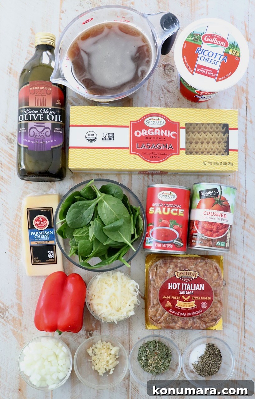 One-Pot Cheesy Lasagna Soup with Italian Sausage 3 ingredients for lasagna soup on white wood board