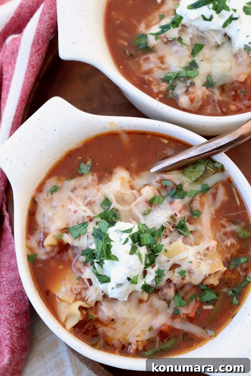 One-Pot Cheesy Lasagna Soup with Italian Sausage 4 lasagna soup in bowls with spoon