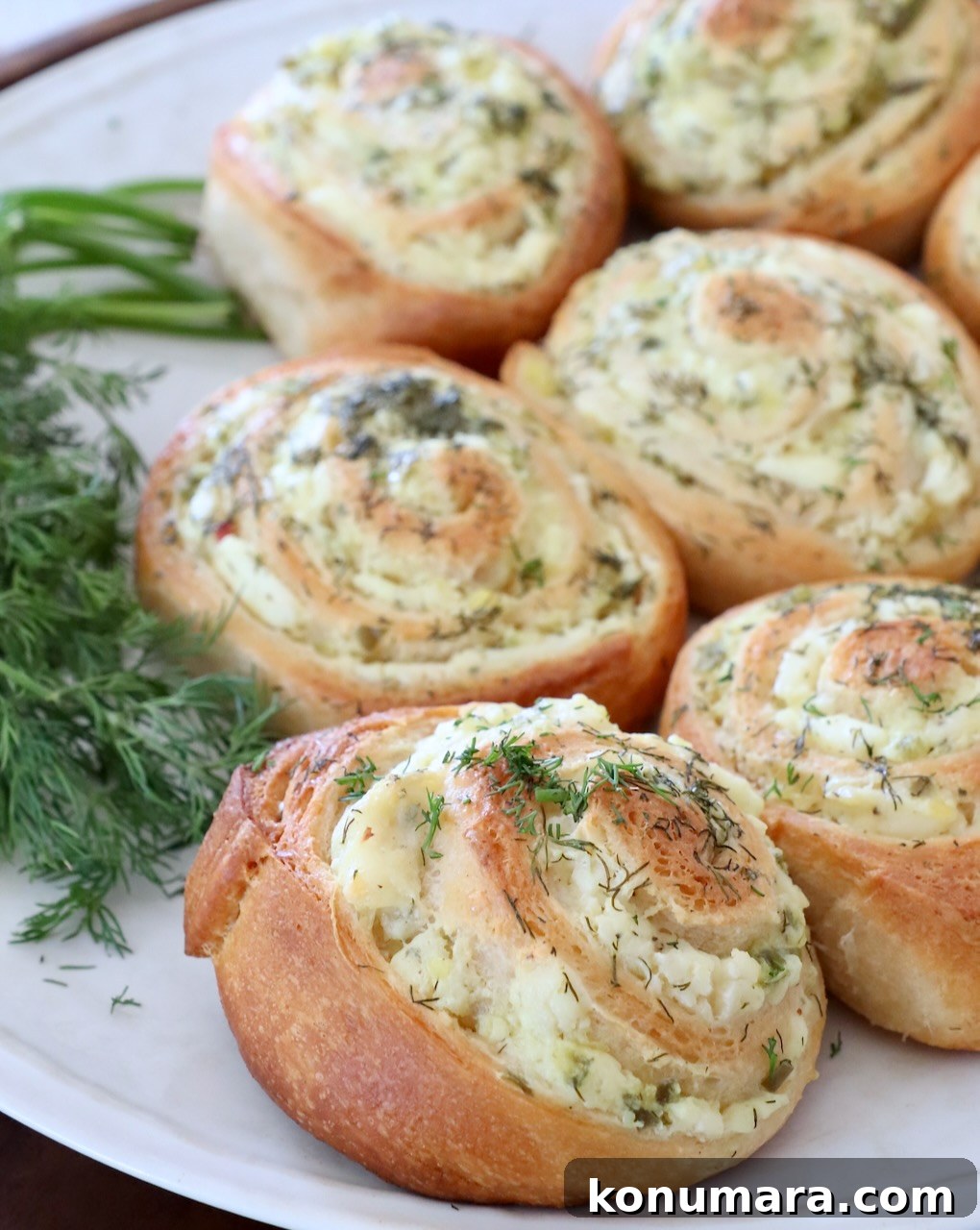 creamy pickle crescent rolls on plate with fresh dill