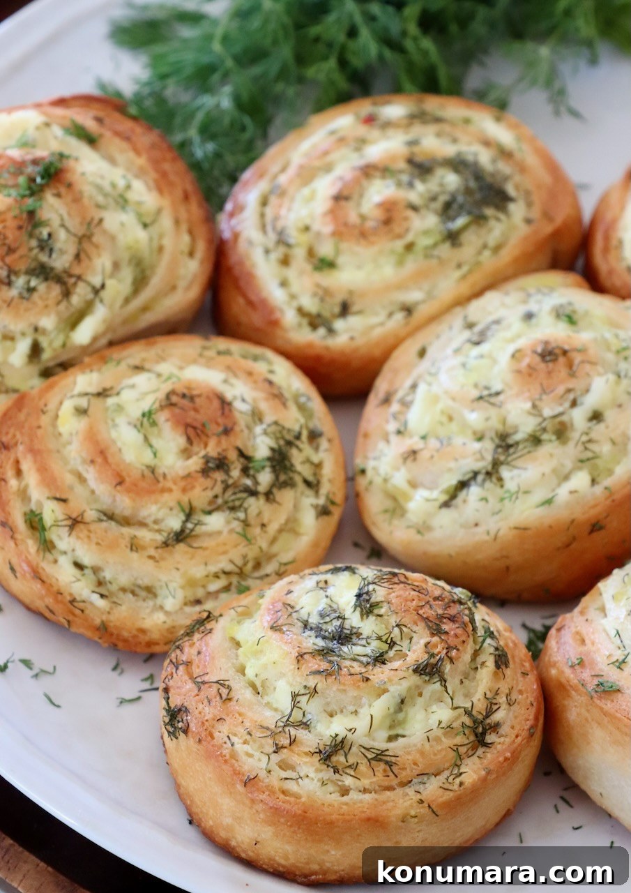 baked pickle crescent rolls on a plate with fresh dill