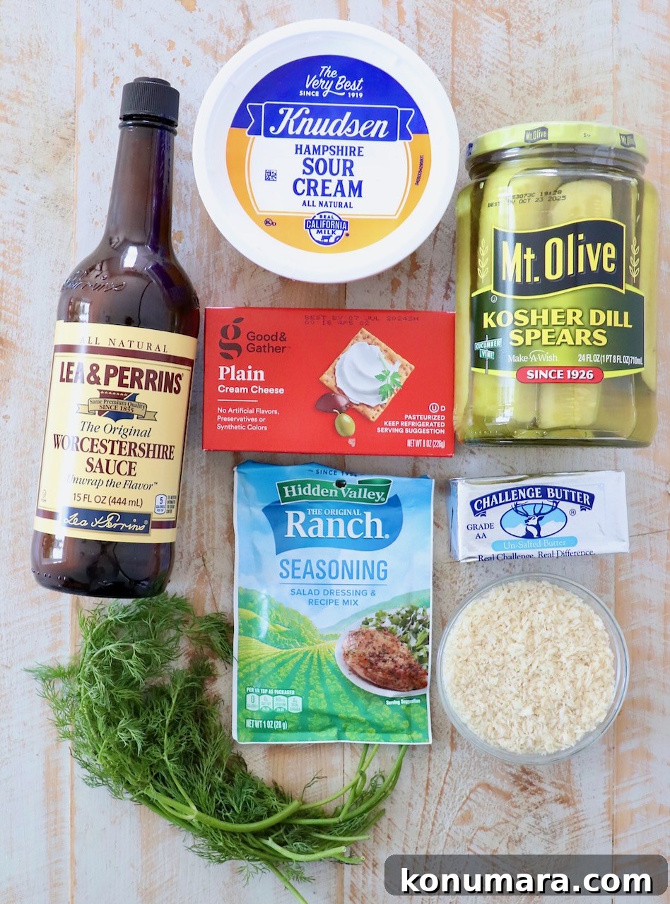 Ingredients for pickle dip on white wood board