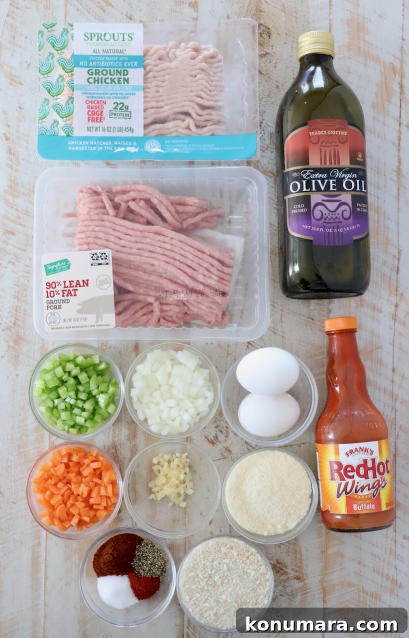 ingredients for buffalo chicken meatballs on white wood board