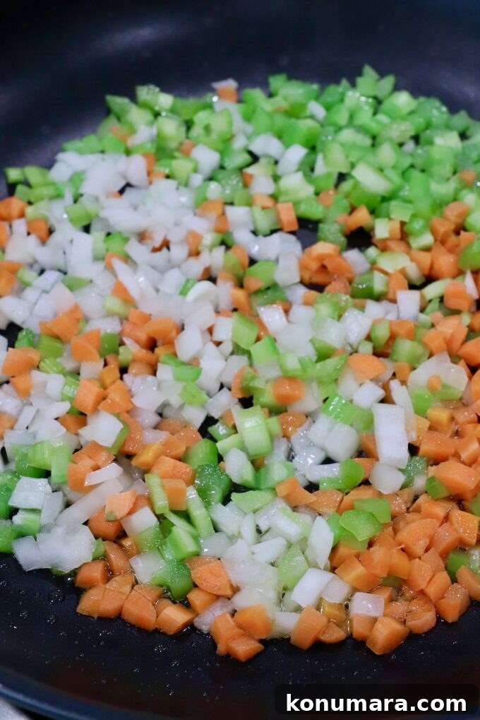diced onions, carrots and celery in a skillet