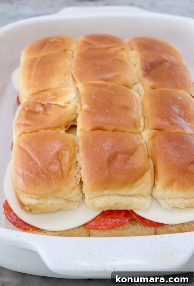 Italian sub sliders in casserole dish