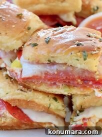 hot Italian sliders stacked up on plate