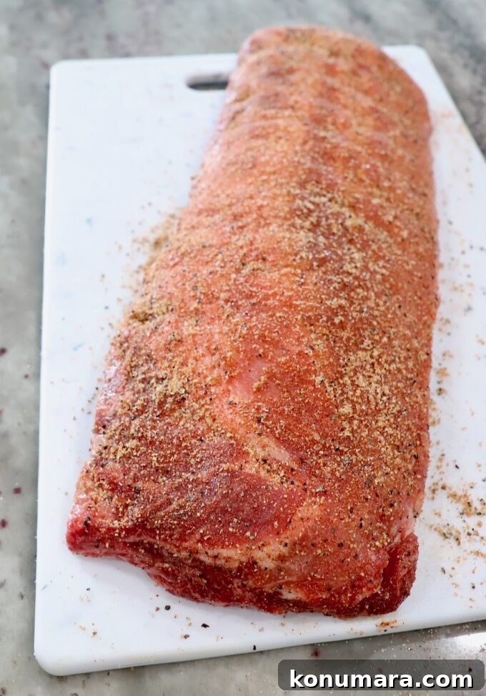 Tender Instant Pot Ribs in 45 Minutes 4 seasoned rack of baby back ribs on white cutting board