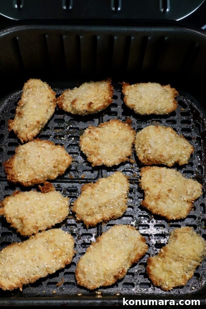 Jack Daniel's BBQ Chicken Strips Recipe 11 cooked breaded chicken strips in an air fryer basket