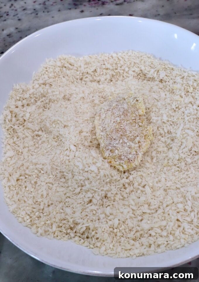 Jack Daniel's BBQ Chicken Strips Recipe 8 piece of chicken coated in breadcrumbs in a bowl