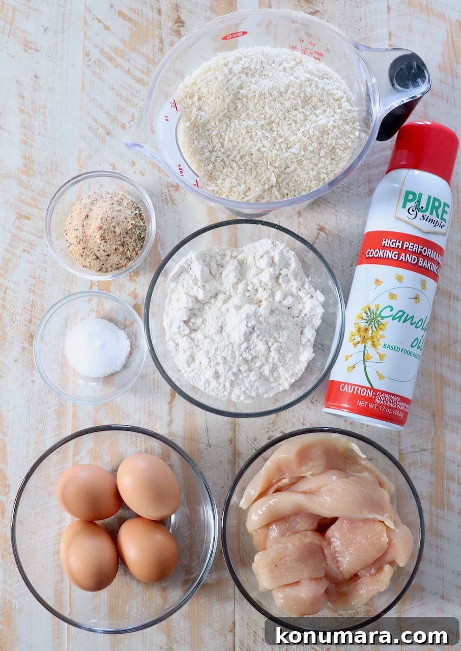 Crispy Air Fryer Chicken Tenders Recipe 3 ingredients for air fryer chicken tenders on white wood board