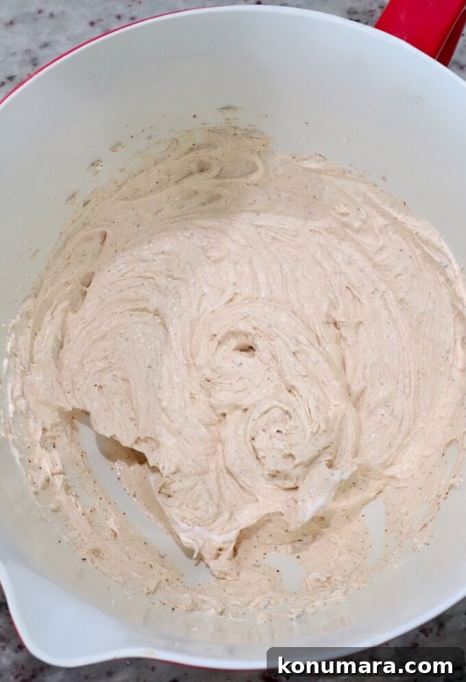 cream cheese, sour cream and spices blended together in large bowl