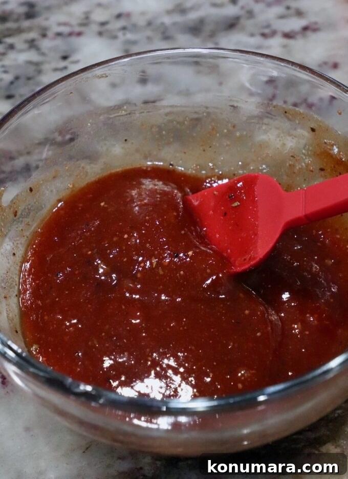 bbq sauce in bowl with pastry brush