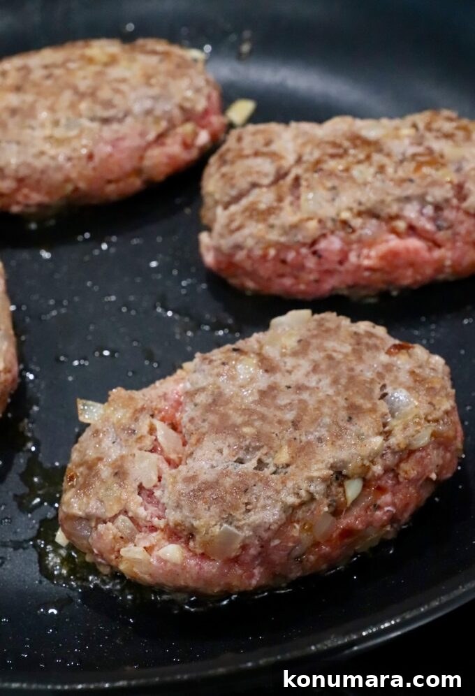 beef patties seared in skillet