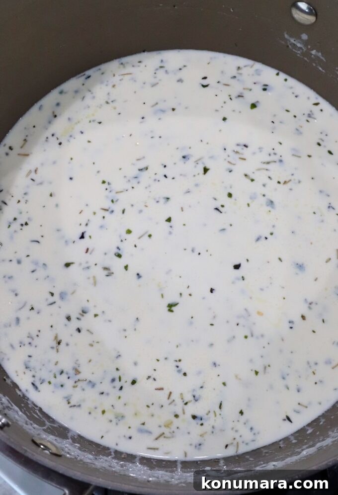 creamy cheese sauce in saucepan