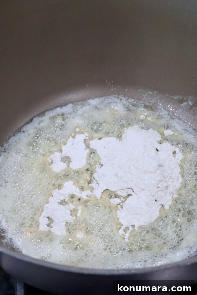 flour in melted butter in a saucepan