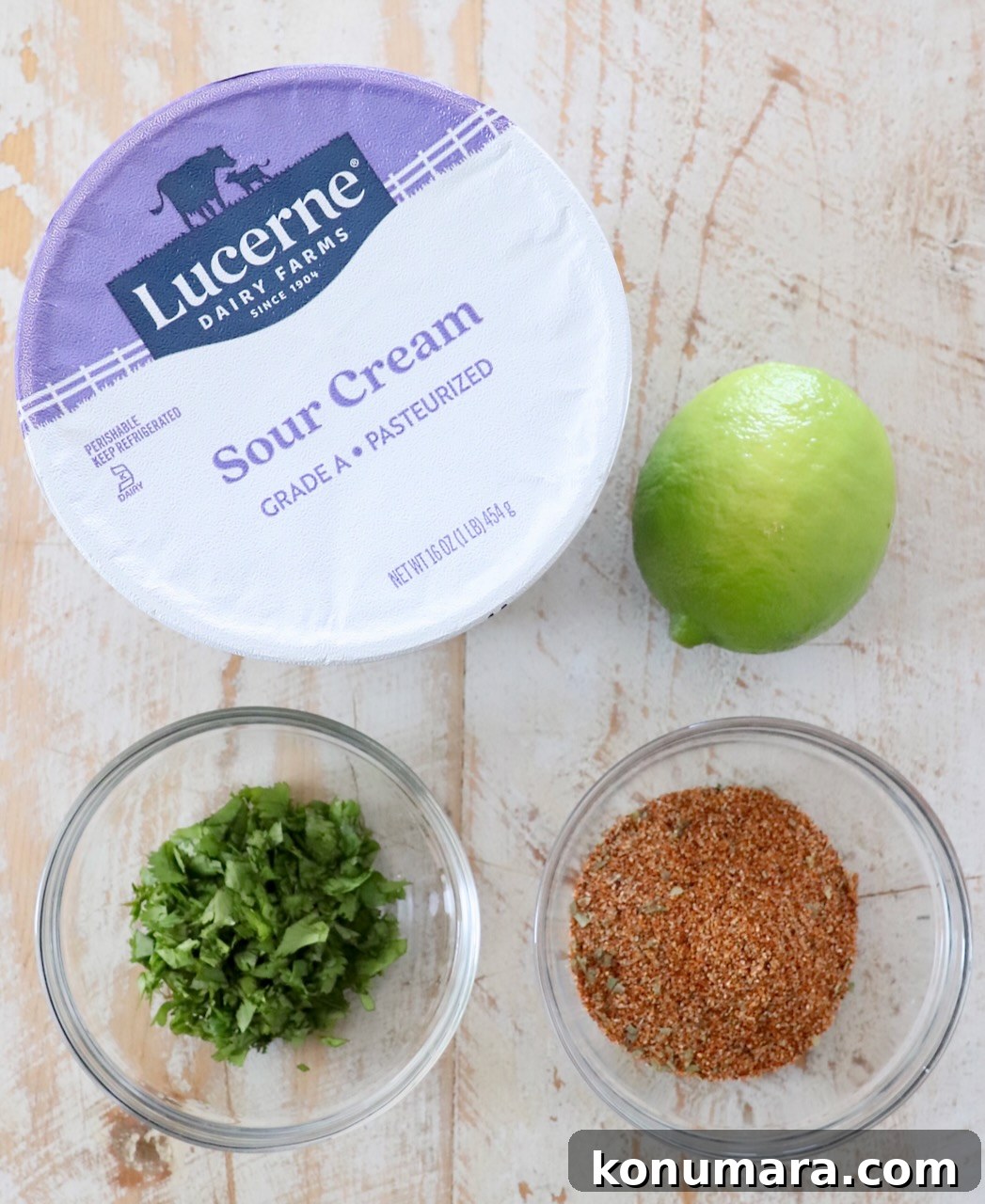 ingredients for southwest salad dressing on white wood board