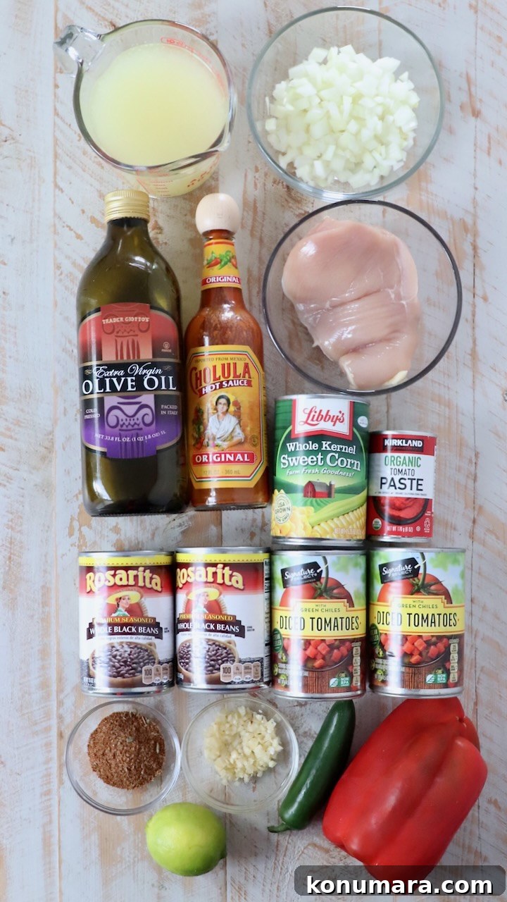 Southwest Chicken Soup Recipe with Corn and Black Beans 3 ingredients for southwest chicken soup on white wood board