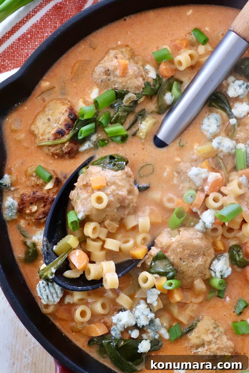 Creamy Buffalo Chicken Soup Recipe 2 buffalo chicken meatball soup in skillet with serving spoon