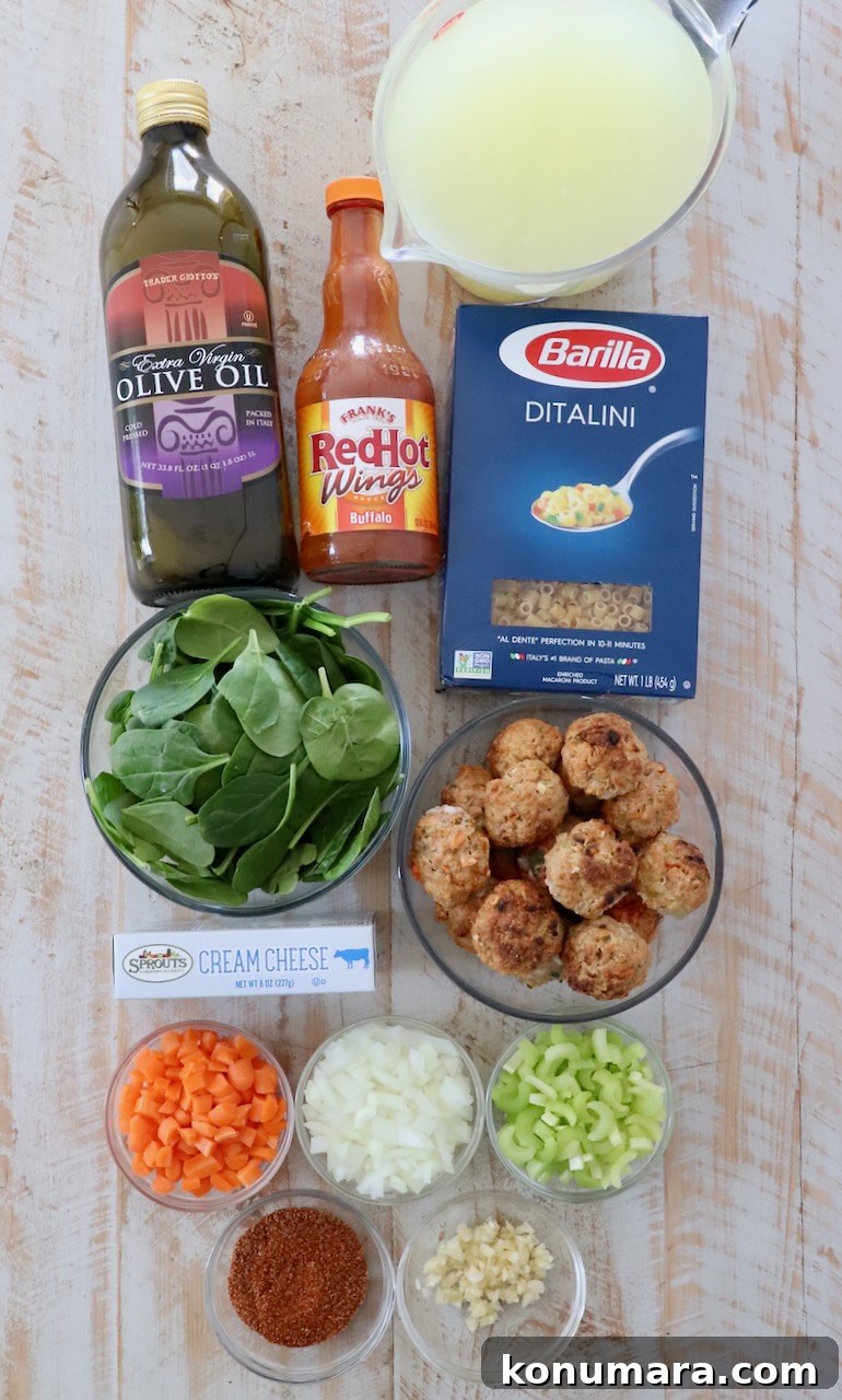 Creamy Buffalo Chicken Soup Recipe 3 ingredients for buffalo chicken meatball soup on a white wood board