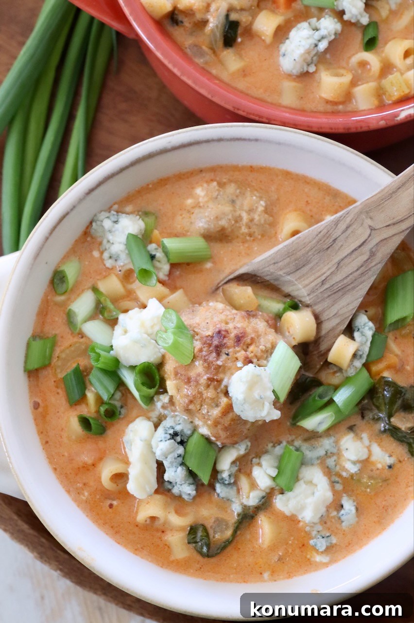 Creamy Buffalo Chicken Soup Recipe 8 buffalo chicken meatball soup in bowls with spoon